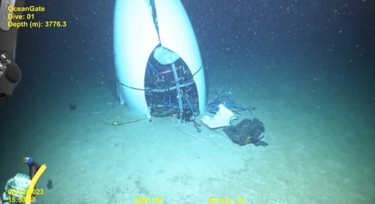 Liikkumaton valokuva videotallennuksesta näyttää Oceangate Titan -sarjan upotettavan valtameren pohjassa vuonna 2023 tapahtuneen räjähdyksen jälkeen. Viisi ihmistä kuoli onnettomuudessa.